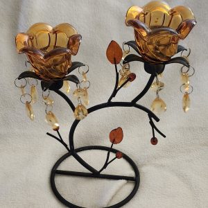 wrought iron candle holder with amber glass rose shaped holder